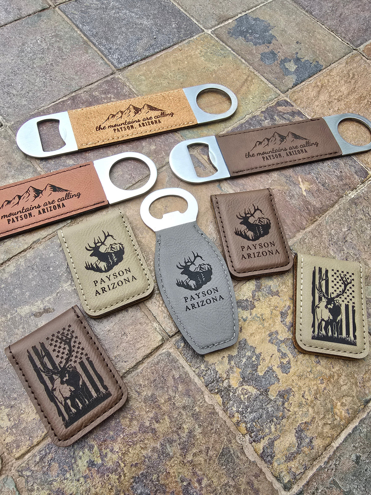 Layout featuring a variety of laser engraved customizable souvenir merchandise, including bottle openers, wallet clips, and other small gift shop products.